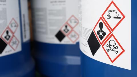 Hazard symbols on the chemical tank.